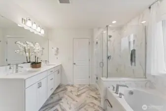 Spa-like primary bathroom with dual-sink vanity, quartz counters, and elegant finishes.