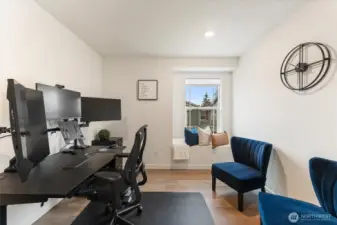Dedicated home office with room for multiple workstations.