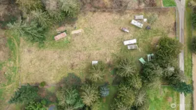 Approx 2 acres is fenced. Seller will be removing vehicles.