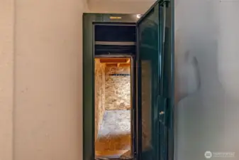 Entrance to storage under stairs in closet