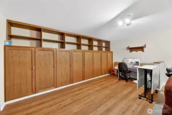 16’ of custom-built wall to wall / floor to ceiling storage cabinet with doors, and book shelf with counter