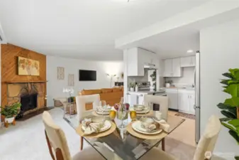 Open-concept layout seamlessly connects the living room, dining space, and kitchen.