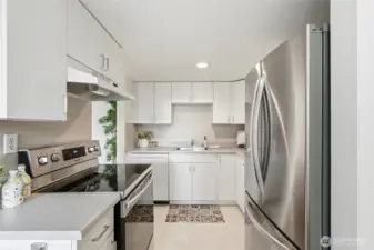 Updated kitchen appliances bring modern convenience to this thoughtfully designed space.