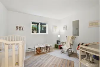 Cozy secondary bedroom offers a comfortable and versatile space, perfect for guests, a home office, or a quiet retreat.