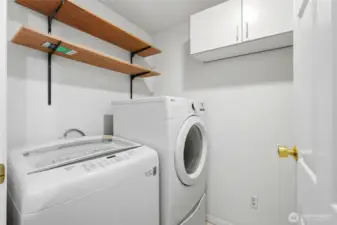 Laundry room with ample storage space.