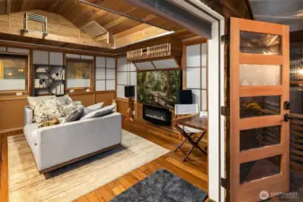 Inspired by a Japanese style, the owner's son transformed this into a bunkhouse.  It does have running water (gray water), a small refrigerator, closet, an electric fireplace heating and is a fun place to escape.