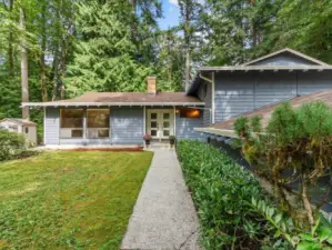 Front of home opens to generous front yard and lots of area to explore