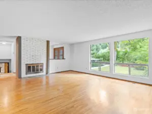 Living room off entry has wood burning fireplace