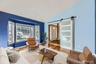 Living room with barn door for privacy