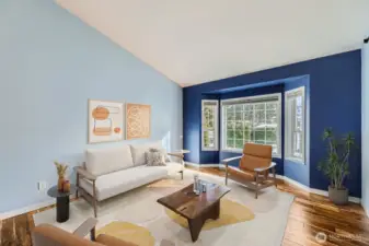 Sunken living room with bay window and high ceilings