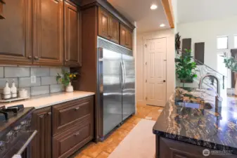 Kitchen with oversized island with veggie sink