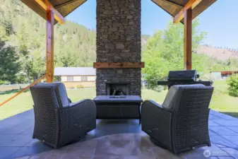 Covered back patio with gas fireplace