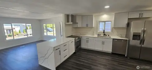 Kitchen looking Northwest with Living room in background