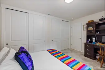 This bedroom has two huge closets and heated floors