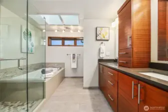 The primary bath with walk-in shower and soaking tub.