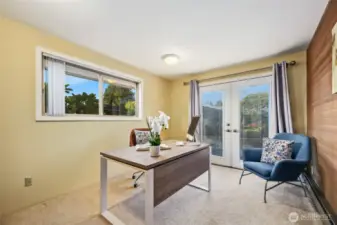 The second bedroom (used as an office) is adjacent to the primary and enjoys access to the back deck.