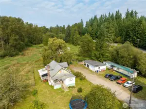 Classic 1920 homestead Farmhouse on 7.36 acres. Hip roof barn, garage/shop and updated Manufactured home