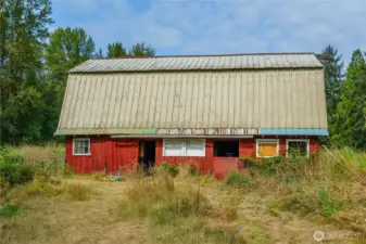 Classic hip roof barn with concrete slab and upstairs mound