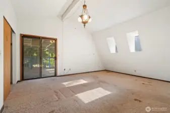 Primary bedroom with balcony