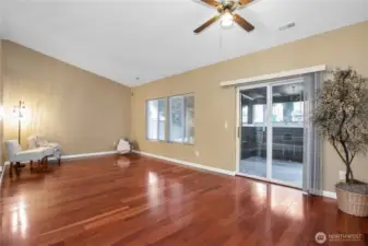 The slider just off of the the living room takes you to a covered porch that is screened in