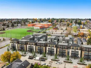 Photo rendering of finished project. A closer aerial perspective highlights the perfect blend of convenience and tranquility that awaits you in this desirable location.