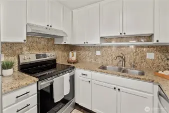 Beautifully updated modern kitchen with granite counters and extra large eating nook.That flows with east to your living space
