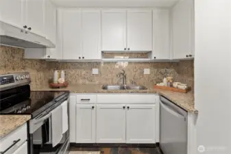 Beautifully updated modern kitchen with granite counters and extra large eating nook.That flows with east to your living space