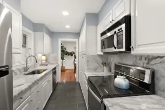 Stainless appliances and generous stainless sink make for clean lines.  Plenty of cabinets means there is a space for everything!
