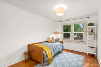 Generous main floor bedroom looks out to the activity in back yard.