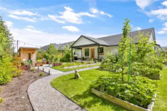 Fruit trees, berries and lots of space for raised bed gardening.