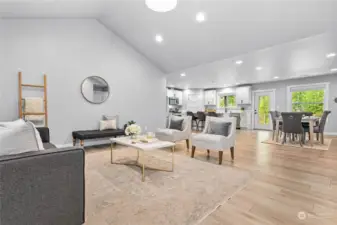 Open concept living room with soaring ceilings.