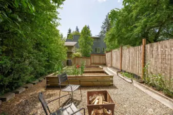 Don't miss the garden area with raised beds & rainwater barrel. Perfect vegi growing space with southern exposure. Possible area to add a studio or a small DADU.