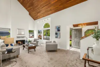 Living room with fireplace, large windows, and fireplace (buyer to verify functionality of fireplace - fire added to photos for appeal)