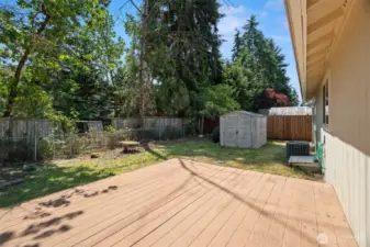 Large Trex Deck in backyard with storage shed