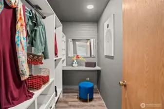 Primary closet with custom built in closet organizing system