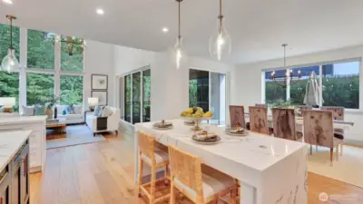 Dual islands, premium Subzero and Wolf appliances, and a party pantry complete with wine fridge, bar sink, and ample cabinetry make entertaining effortless and enjoyable.