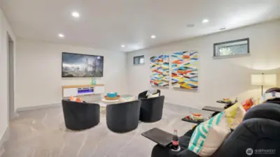 The lower level is designed for relaxation and recreation, with an inviting home theater complete with cozy theatre seating, electric fireplace and blackout shades. Perfect for games days and movie nights!