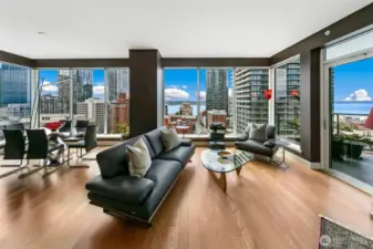 open living room spacious floor plan with  10 ft floor to ceiling windows facing West