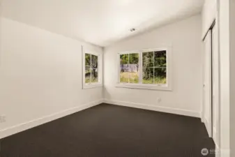 SW corner guest bedroom upstairs. Vaulted ceilings to increase light exposure for NW days....
