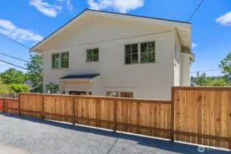 Privately situated with thoughtfully designed hardscaping and fences offer an airy & open urban oasis. Small yard offers plenty of space for pets or a modified dog run.