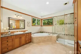 Owner Suite en-suite bathroom with corner jet tub and large shower.