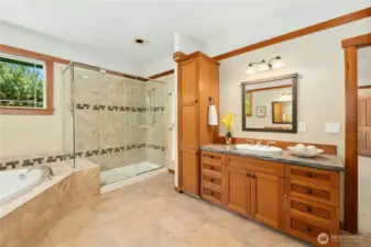 Owner Suite en-suite bathroom with corner jet tub and large shower.