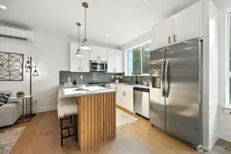 Gourmet Kitchen with quartz counters and stainless appliances
