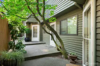 Tree lined private entrance from Fauntleroy Way SW.