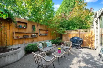 This is your private oasis! Patio with mature vegetation, ample room for lounging, and enjoying the outdoors.