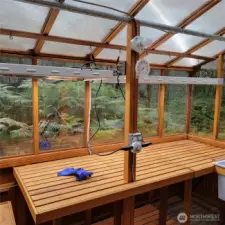 Two 4', 8 lamp grow lights with height adjusting pulleys. professionally installed electrical system. Polycarbonate roof hold up to impacts.