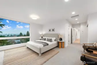 Spacious primary bedroom with generous windows for great natural light.