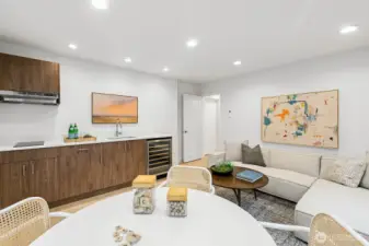 ADU with small kitchenette (stovetop on the left + beverage fridge). Works well for multi-generational living, separate ADU, or as an integrated media/rec room.