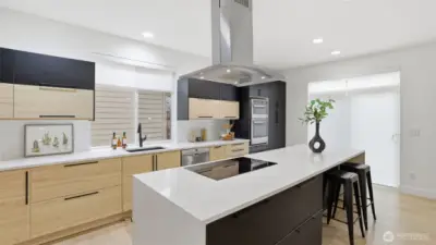 Chef’s kitchen with statement island and clean lines, a stylish hub for everyday life.