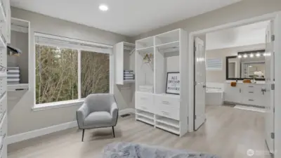 Expansive walk-in closet with custom shelving and direct access to the primary bath.